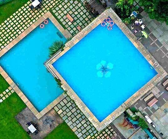 Infinity pool and kids pool with 20ft waterfall at Manas Resort